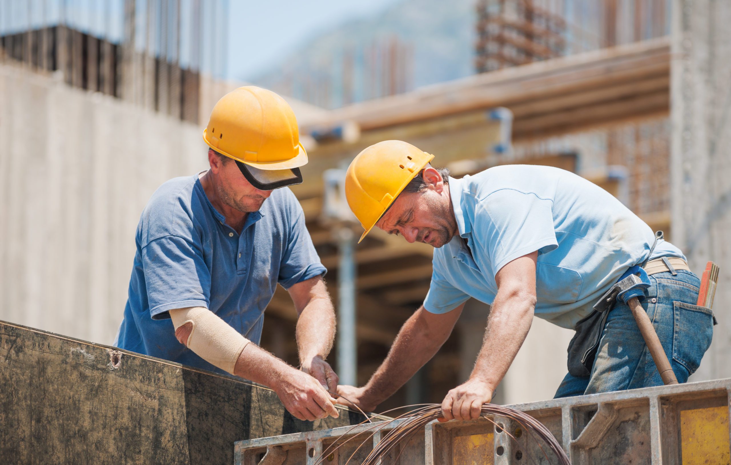 Blog - Construction workers working on cement formwork frames