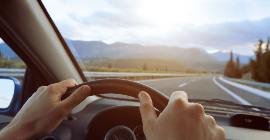 hands holding steering wheel