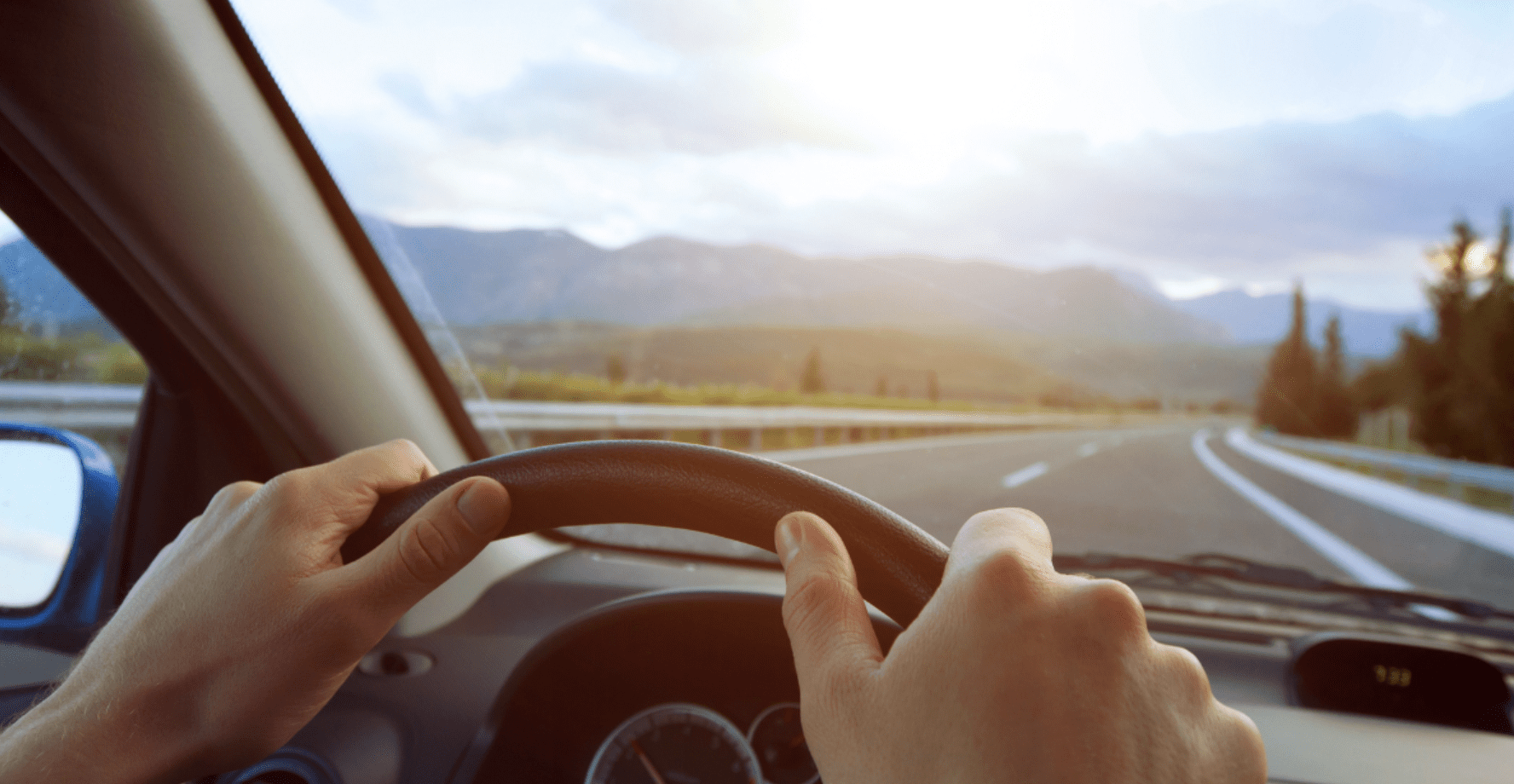 hands holding steering wheel